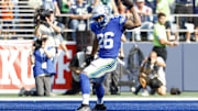 Sep 8, 2024; Seattle, Washington, USA; Seattle Seahawks running back Zach Charbonnet (26) celebrates after catching a touchdown pass against the Denver Broncos during the fourth quarter at Lumen Field. Mandatory Credit: Joe Nicholson-Imagn Images