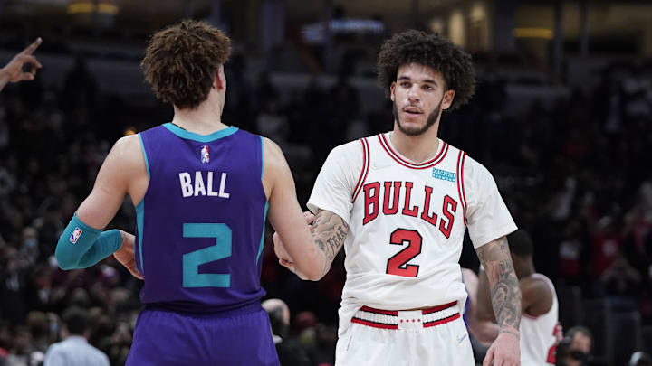 Nov 29, 2021; Chicago, Illinois, USA; Charlotte Hornets guard LaMelo Ball (2) and Chicago Bulls guard Lonzo Ball (2) hug after the game at United Center. Mandatory Credit: David Banks-Imagn Images