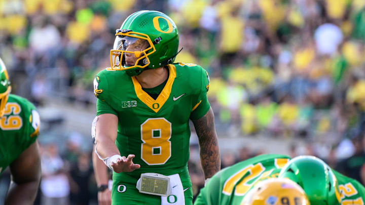 Aug 31, 2024; Eugene, Oregon, USA; Oregon Ducks quarterback Dillon Gabriel (8) surveys the defense during the third quarter against the Idaho Vandals at Autzen Stadium. Mandatory Credit: Craig Strobeck-Imagn Images