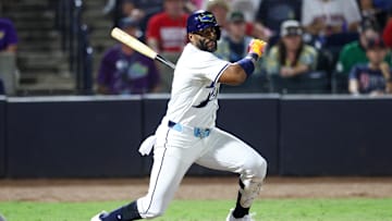 Sep 20, 2025; Tampa, Florida, USA; Tampa Bay Rays first baseman Yandy Diaz (2) hits an rbi single against the Boston Red Sox in the seventh inning at George M. Steinbrenner Field. 