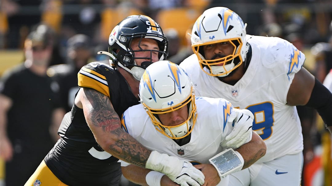 Sep 22, 2024; Pittsburgh, Pennsylvania, USA; Pittsburgh Steelers linebacker Nick Herbig (51) sacks Los Angeles Chargers quarterback Taylor Heinicke (8) during the third quarter at Acrisure Stadium. Mandatory Credit: Barry Reeger-Imagn Images