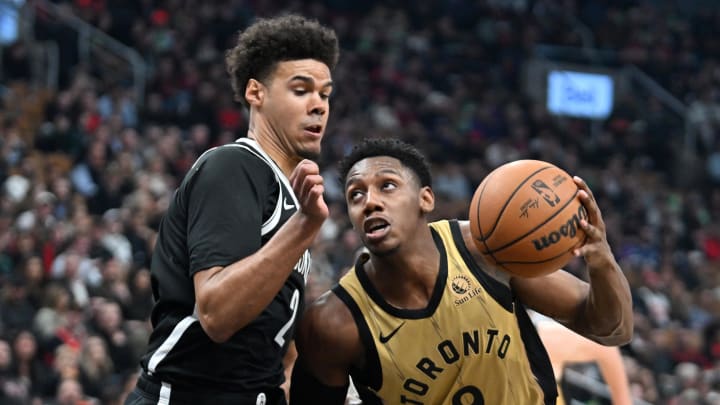 Feb 22, 2024; Toronto, Ontario, CAN;   Toronto Raptors forward RJ Barrett (9) drives to the basket against Brooklyn Nets forward Cam Johnson (2) in the first half at Scotiabank Arena. Mandatory Credit: Dan Hamilton-USA TODAY Sports