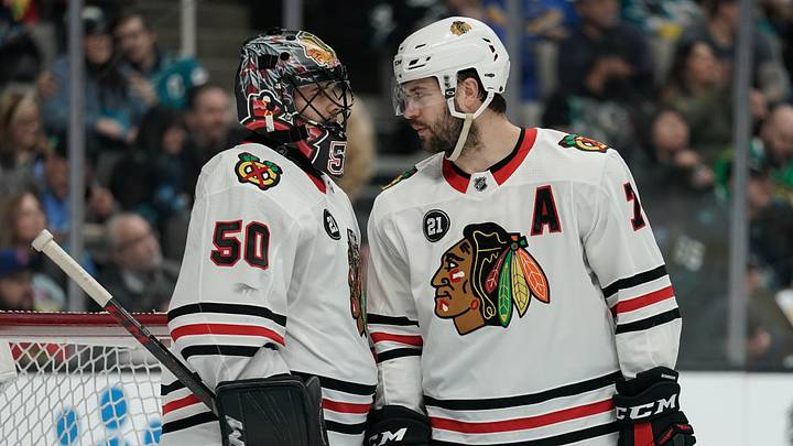 Mar 28, 2019; San Jose, CA, USA; Chicago Blackhawks goaltender Corey Crawford (50) and defenseman Brent Seabrook (7) talk during the second period against the San Jose Sharks at SAP Center at San Jose. Mandatory Credit: Stan Szeto-USA TODAY Sports