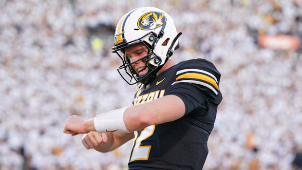 Missouri quarterback Brady Cook celebrates in the end zone.