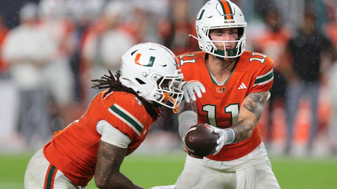 Sep 20, 2025; Miami Gardens, Florida, USA; Florida Gators wide receiver Aidan Mizell (11) handoffs the football to running back Mark Fletcher Jr. (4) against the Florida Gators during the fourth quarter at Hard Rock Stadium. Mandatory Credit: Sam Navarro-Imagn Images