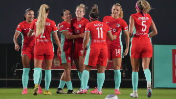 Jul 20, 2024; Kansas City, Missouri, USA; Kansas City Current forward Kristen Hamilton (25) celebrates with teammates after scoring a goal during the second half against the Houston Dash at CPKC Stadium. Mandatory Credit: Denny Medley-USA TODAY Sports