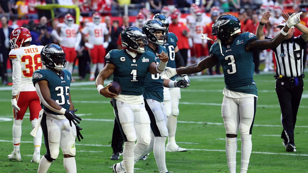 Feb 12, 2023; Glendale, Arizona, US; Philadelphia Eagles quarterback Jalen Hurts (1) celebrates with running back Boston Scott (35) and wide receiver Zach Pascal (3) after scoring a touchdown against the Kansas City Chiefs in the first quarter of Super Bowl LVII at State Farm Stadium. Mandatory Credit: Bill Streicher-Imagn Images