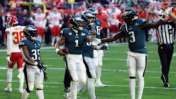 Feb 12, 2023; Glendale, Arizona, US; Philadelphia Eagles quarterback Jalen Hurts (1) celebrates with running back Boston Scott (35) and wide receiver Zach Pascal (3) after scoring a touchdown against the Kansas City Chiefs in the first quarter of Super Bowl LVII at State Farm Stadium. Mandatory Credit: Bill Streicher-Imagn Images
