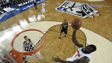 Apr 5, 2014; Arlington, TX, USA; Florida Gators center Patric Young (4) shoots the ball against Connecticut Huskies forward DeAndre Daniels (2) during the second half during the semifinals of the Final Four in the 2014 NCAA Mens Division I Championship tournament at AT&T Stadium. Mandatory Credit: Chris Steppig, NCAA Photos/Pool via Imagn Images