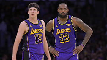Jan 17, 2025; Los Angeles, California, USA;  Los Angeles Lakers guard Austin Reaves (15) and forward LeBron James (23) talk on the court against the Brooklyn Nets at Crypto.com Arena. Mandatory Credit: Jayne Kamin-Oncea-Imagn Images