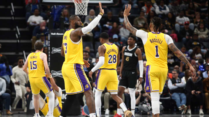 Mar 27, 2024; Memphis, Tennessee, USA; Los Angeles Lakers forward LeBron James (23) reacts with guard D'Angelo Russell (1) during the second half against the Memphis Grizzlies at FedExForum. Mandatory Credit: Petre Thomas-USA TODAY Sports