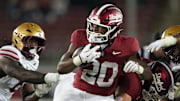 Sep 13, 2025; Stanford, California, USA; Stanford Cardinal running back Micah Ford (20) carries the ball against the Boston College Eagles during the fourth quarter at Stanford Stadium. Mandatory Credit: Darren Yamashita-Imagn Images