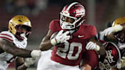 Sep 13, 2025; Stanford, California, USA; Stanford Cardinal running back Micah Ford (20) carries the ball against the Boston College Eagles during the fourth quarter at Stanford Stadium. Mandatory Credit: Darren Yamashita-Imagn Images