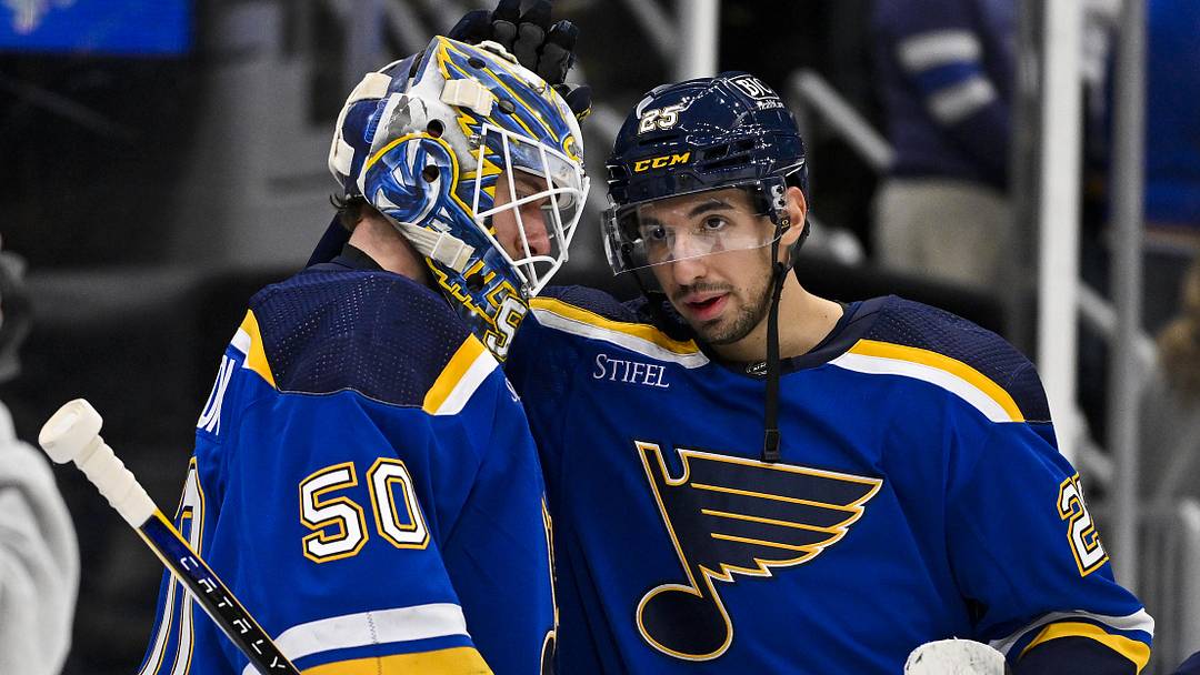 Jan 11, 2024; St. Louis, Missouri, USA;  St. Louis Blues center Jordan Kyrou (25) and goaltender Jordan Binnington (50) celebrate after the Blues defeated the New York Rangers at Enterprise Center. Mandatory Credit: Jeff Curry-Imagn Images