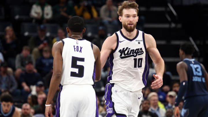 Jan 29, 2024; Memphis, Tennessee, USA; Sacramento Kings forward Domantas Sabonis (10) reacts with guard De'Aaron Fox (5) during the second half against the Memphis Grizzlies at FedExForum. Mandatory Credit: Petre Thomas-USA TODAY Sports