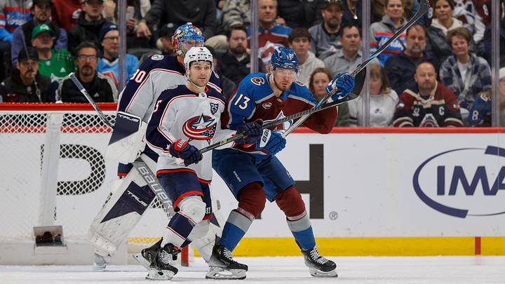 Jan 10, 2026; Denver, Colorado, USA; Columbus Blue Jackets defenseman Denton Mateychuk (5) and Colorado Avalanche right wing Valeri Nichushkin (13) battle for position in front of goaltender Elvis Merzlikins (90) in the first period at Ball Arena. Mandatory Credit: Isaiah J. Downing-Imagn Images