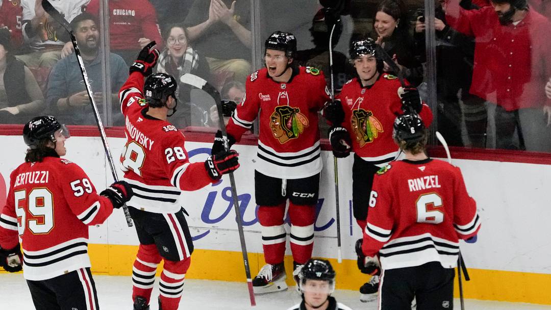 Oct 28, 2025; Chicago, Illinois, USA; Chicago Blackhawks center Connor Bedard, (center) celebrates his goal against the Ottawa Senators with his teammates during the first period at United Center. Mandatory Credit: David Banks-Imagn Images