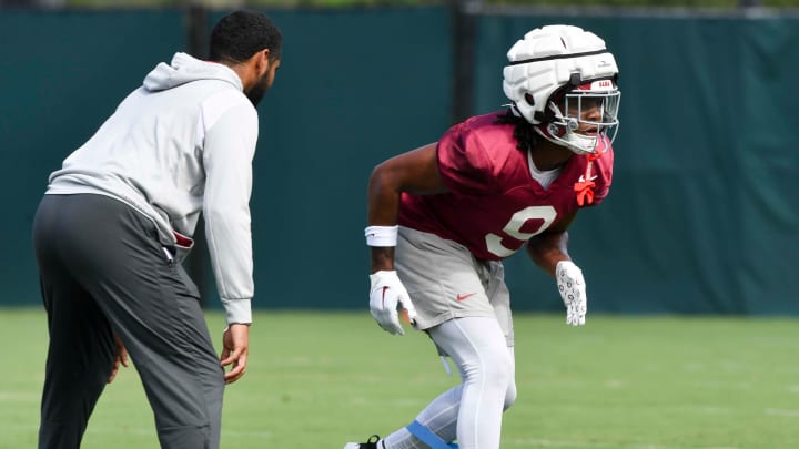 The Crimson Tide football team continued practice Thursday, Aug. 1, 2024, as they prepare for the season opener and the first game under new head coach Kalen DeBoer. Alabama defensive back Jaylen Mbakwe (9) runs a drill using a band to restrict his lower legs.