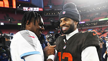 Dec 7, 2025; Cleveland, Ohio, USA; Cleveland Browns quarterback Shedeur Sanders (12) shakes hands with Tennessee Titans quarterback Cam Ward (1) after the game at Huntington Bank Field. Mandatory Credit: Ken Blaze-Imagn Images