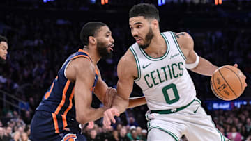 Apr 8, 2025; New York, New York, USA; Boston Celtics forward Jayson Tatum (0) drives to the basket while being defended by New York Knicks forward Mikal Bridges (25) during the second half at Madison Square Garden. Mandatory Credit: John Jones-Imagn Images