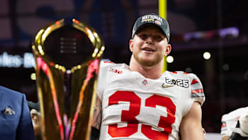 Jan 20, 2025; Atlanta, GA, USA; Ohio State Buckeyes defensive end Jack Sawyer (33) celebrates after defeating the Notre Dame Fighting Irish in the CFP National Championship college football game at Mercedes-Benz Stadium. Mandatory Credit: Mark J. Rebilas-Imagn Images