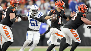 Dec 10, 2023; Cincinnati, Ohio, USA; Indianapolis Colts defensive end Kwity Paye (51) moves in as Cincinnati Bengals quarterback AJ McCarron (4) draws back to pass at Paycor Stadium. Mandatory Credit: Bob Scheer-Imagn Images