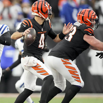 Dec 10, 2023; Cincinnati, Ohio, USA; Indianapolis Colts defensive end Kwity Paye (51) moves in as Cincinnati Bengals quarterback AJ McCarron (4) draws back to pass at Paycor Stadium. Mandatory Credit: Bob Scheer-Imagn Images