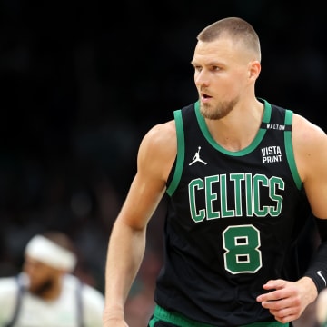 Jun 9, 2024; Boston, Massachusetts, USA; Boston Celtics center Kristaps Porzingis (8) reacts after a play against the Dallas Mavericks during the first quarter in game two of the 2024 NBA Finals at TD Garden. Mandatory Credit: Peter Casey-USA TODAY Sports