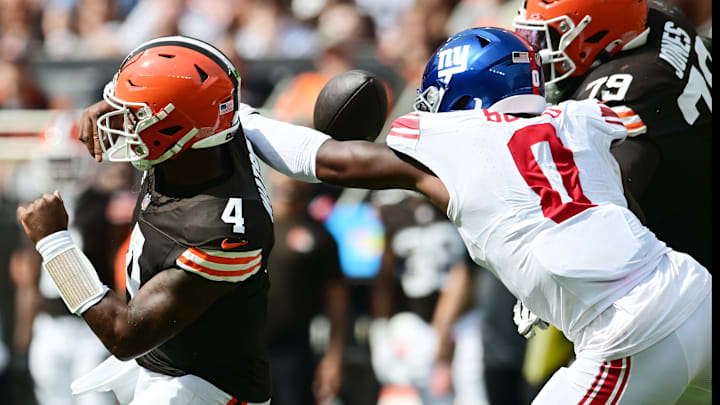 Sep 22, 2024; Cleveland, Ohio, USA; New York Giants linebacker Brian Burns (0) strip sacks Cleveland Browns quarterback Deshaun Watson (4) during the first half at Huntington Bank Field. Mandatory Credit: Ken Blaze-Imagn Images