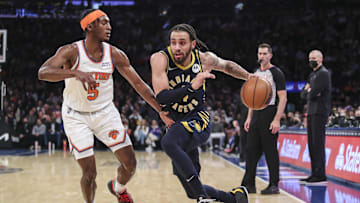 Jan 4, 2022; New York, New York, USA;  Indiana Pacers guard Duane Washington Jr. (4) drives past New York Knicks guard Immanuel Quickley (5) in the second quarter at Madison Square Garden. Mandatory Credit: Wendell Cruz-Imagn Images