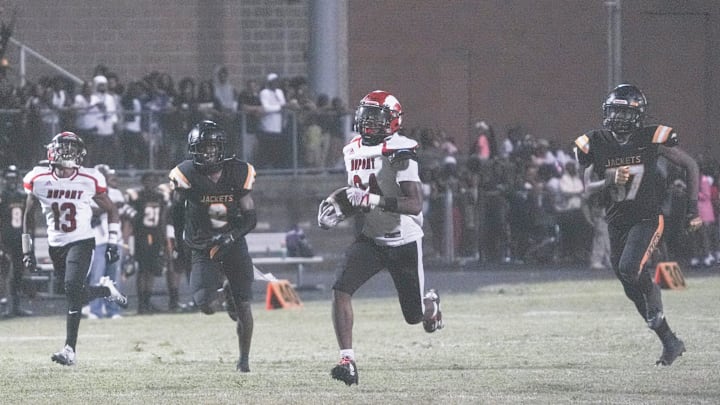 DuPont Manual's Gerian Traynor made the game-deciding touchdown on a big run in the third quarter to put the Crimsons up over the Yellowjackets at Ty Scroggins Stadium Friday night in Louisville high school football. August 23, 2024