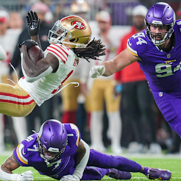 Oct 23, 2023; Minneapolis, Minnesota, USA; San Francisco 49ers wide receiver Brandon Aiyuk (11) is tackled by Minnesota Vikings cornerback Byron Murphy Jr. (7) in the second quarter at U.S. Bank Stadium.