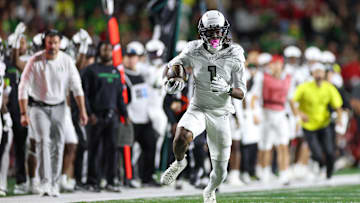  A true freshman from Duncanville, Texas with elite speed and body control, Dakorien Moore has been an immediate difference-maker and explosive weapon for the Ducks.