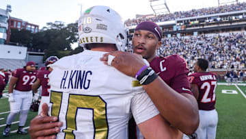 Oct 11, 2025; Atlanta, Georgia, USA; Georgia Tech Yellow Jackets quarterback Haynes King (10) talks to Virginia Tech Hokies quarterback Kyron Drones (1) after a game at Bobby Dodd Stadium at Hyundai Field. Mandatory Credit: Brett Davis-Imagn Images

