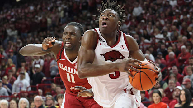 Arkansas Razorbacks forward Adou Thiero (3) drives past Alabama Crimson Tide center Clifford Omoruyi (11)
