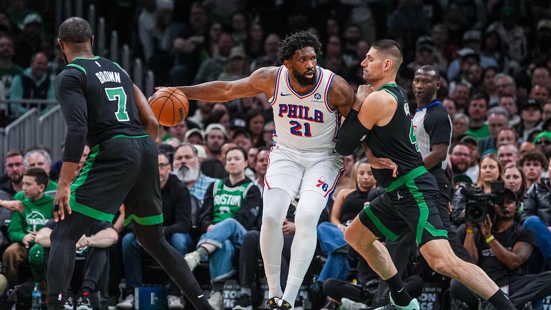 Apr 28, 2026; Boston, Massachusetts, USA; Philadelphia 76ers center Joel Embiid (21) moves the ball against Boston Celtics center Nikola Vucevic (4) in the second half during game five of the first round of the 2026 NBA Playoffs at TD Garden. Mandatory Credit: David Butler II-Imagn Images