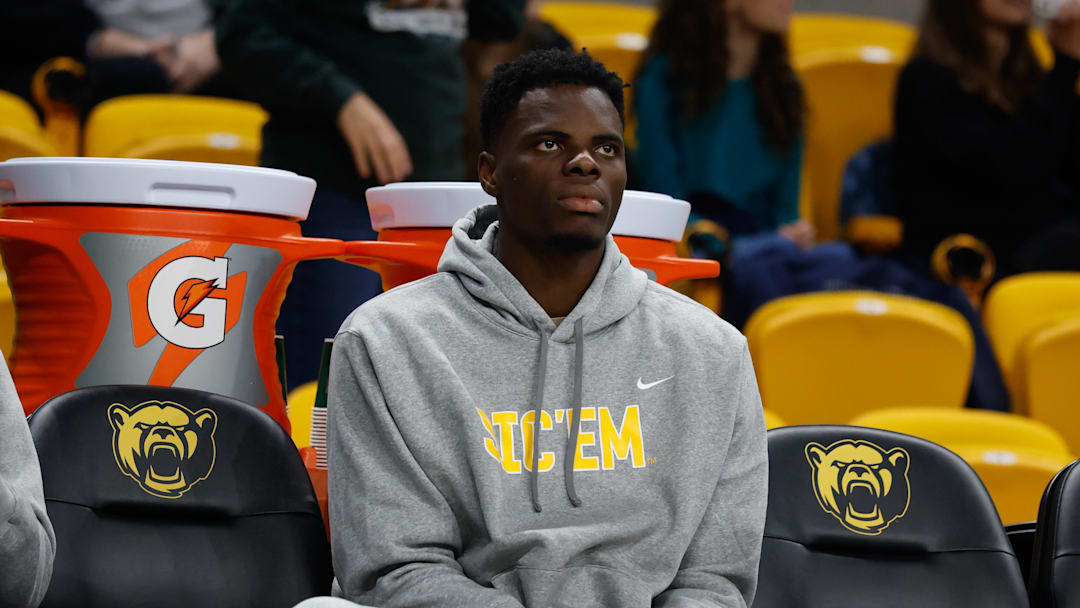 Dec 29, 2025; Waco, Texas, USA; Baylor Bears center James Nnaji (46) in street clothes on the bench.