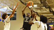 Utah Prep's AJ Dybantsa drives to the basket on Highland's Jemal Smith, left, and Josh Hamilton during a game at Emmanuel College in Boston on Tuesday, Nov. 5, 2024.
