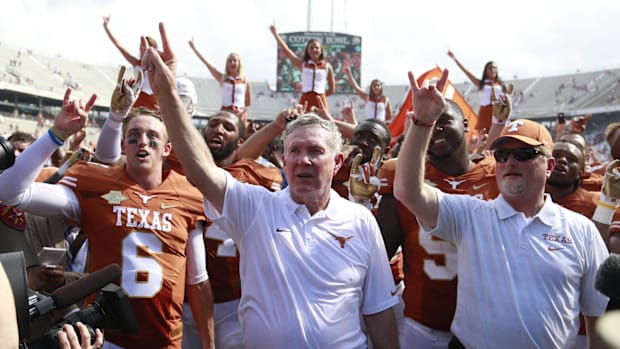 Mack Brown celebrates a Longhorns win in 2013.