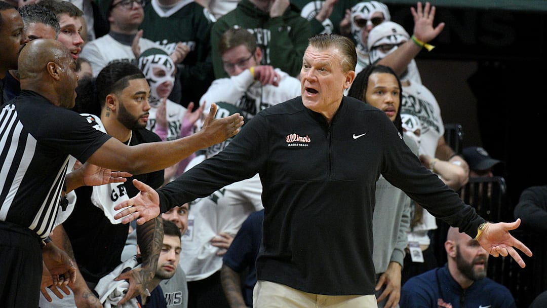 Feb 7, 2026; East Lansing, Michigan, USA;  Illinois Fighting Illini head coach Brad Underwood protests a call during the first half against the Michigan State Spartans at Jack Breslin Student Events Center. Mandatory Credit: Dale Young-Imagn Images
