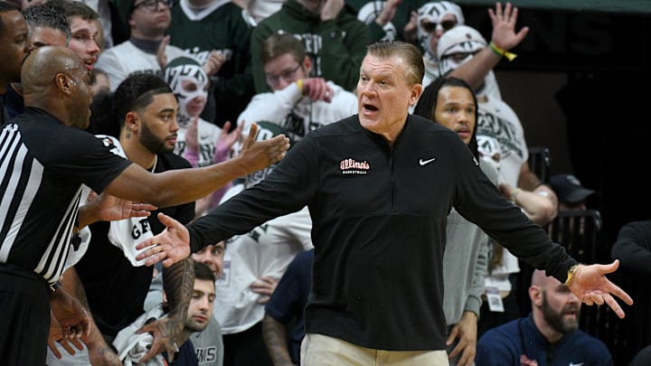 Feb 7, 2026; East Lansing, Michigan, USA;  Illinois Fighting Illini head coach Brad Underwood protests a call during the first half against the Michigan State Spartans at Jack Breslin Student Events Center. Mandatory Credit: Dale Young-Imagn Images