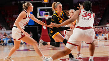Iowa Hawkeyes guard Lucy Olsen (33) drives to the lane during the second round of the NCAA March Madness Women's college basketball game between University of Oklahoma Sooners and Iowa Hawkeyes at the Lloyd Noble Center in Norman, Okla., Monday, March 24, 2025.