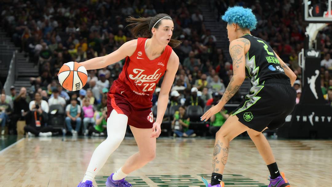 Jul 28, 2026; Seattle, Washington, USA; Indiana Fever guard Caitlin Clark (22) dribbles the ball while guarded by Seattle Storm guard Natisha Hiedeman (2) during the the second half at Climate Pledge Arena. Mandatory Credit: Steven Bisig-Imagn Images