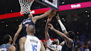 Dec 5, 2025; Oklahoma City, Oklahoma, USA; Oklahoma City Thunder center Chet Holmgren (7) blocks a shot by Dallas Mavericks forward Anthony Davis (3) during the second quarter at Paycom Center.