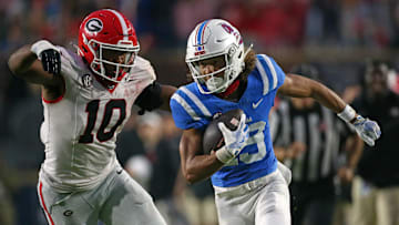 Nov 9, 2024; Oxford, Mississippi, USA; Mississippi Rebels wide receiver Cayden Lee (19) runs after a catch as Georgia Bulldogs linebacker Damon Wilson II (10) pursues during the second half at Vaught-Hemingway Stadium. Mandatory Credit: Petre Thomas-Imagn Images