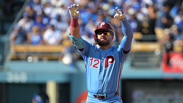 Oct 9, 2025; Los Angeles, California, USA; Philadelphia Phillies left fielder Kyle Schwarber (12) reacts after a double in the first inning against the Los Angeles Dodgers during game four of the NLDS round for the 2025 MLB playoffs at Dodger Stadium. Mandatory Credit: Jayne Kamin-Oncea-Imagn Images