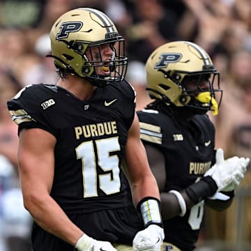 Purdue Boilermakers defensive end Will Heldt (15) celebrates a sack 