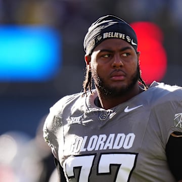 Nov 16, 2024; Boulder, Colorado, USA; Colorado Buffaloes offensive tackle Jordan Seaton (77) looks on before the game against the Utah Utes at Folsom Field. Mandatory Credit: Ron Chenoy-Imagn Images