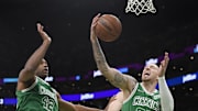 Apr 1, 2022; Boston, Massachusetts, USA; Boston Celtics center Daniel Theis (27) grabs a rebound while center Al Horford (42) looks on during the first half against the Indiana Pacers at TD Garden. Mandatory Credit: Bob DeChiara-Imagn Images