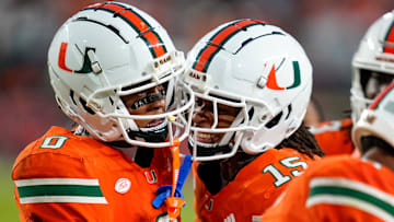 Nov 8, 2025; Miami Gardens, Florida, USA; Miami Hurricanes wide receiver Keelan Marion (0) celebrates with wide receiver Daylyn Upshaw (15) after a touchdown pass against the Syracuse Orange during the third quarter at Hard Rock Stadium. Mandatory Credit: Jeff Romance-Imagn Images